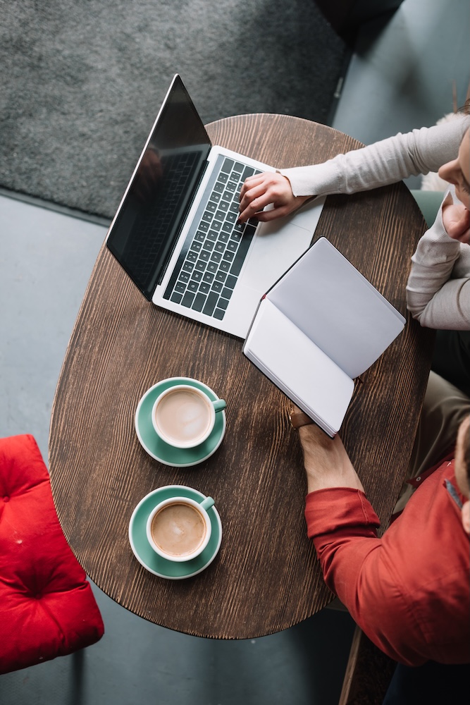 Discussion of SEO plan over coffee